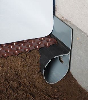 Closeup of a crawl space drainage system installed in Irmo