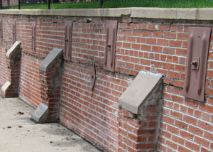 Rusted wall plate anchors in a retaining wall repair in Orangeburg.