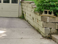 a failing retaining wall around a driveway in Charleston
