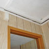 The ceiling and wall separating as the wall sinks with the slab floor in a Evans home
