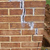 Tuckpointing that cracked due to foundation settlement of a Columbia home