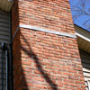 A tilting chimney on a Piedmont home with a leaning, tilting chimney that was temporarily repaired.