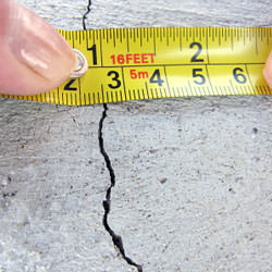 A crack in a poured concrete wall that's showing a normal crack during curing in Sumter