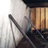 Temporary foundation wall supports stabilizing a Greenville home