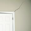 A long drywall crack beginning at the corner of a doorway in a North Augusta home.