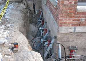 Foundation push piers installed around a house with a foundation settlement issues in Irmo