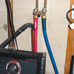 Washer hoses in a basement  in Piedmont