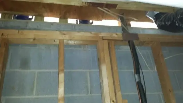 Even lower than the garage, we discovered that the basement wall 2 floors below the master bathroom was bowing in and we needed to address this issue first before doing anything else.