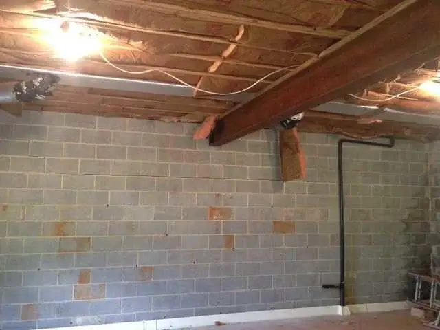 The homeowner's bowing foundation wall before any repair.