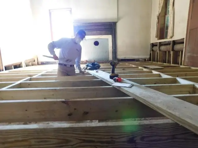 SmartJacks are installed to fit snugly under the main beams to ensure stability of the new floor.