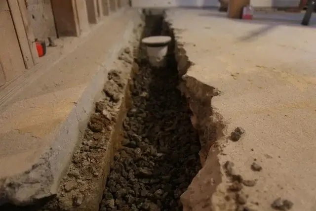 French Drain installed in interior basement room.