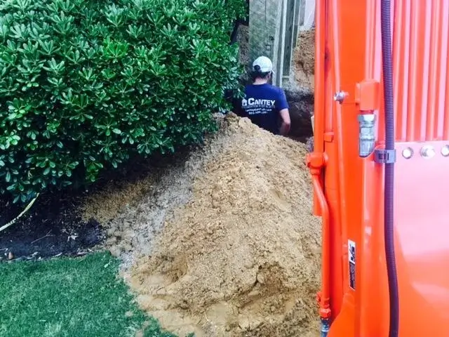 Crew Member David Hinson, Jr. is preparing to install the helical piers.