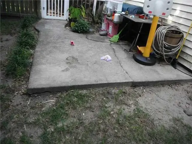 This concrete slab is cracked and uneven but can be fixed thanks to our PolyLevel process.  The PolyLevel polyurethane will lift and level this slab back into its original place.