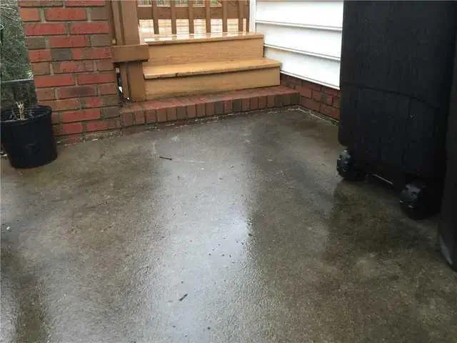 The steps to Allen's home from the driveway, you can see where the concrete is sunk down at the left side of the photo.