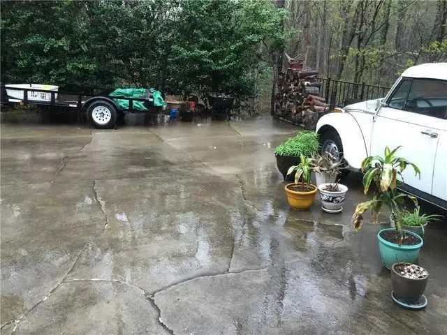 Cracks ran up and down Allen's driveway and caused many unlevel surface issues.