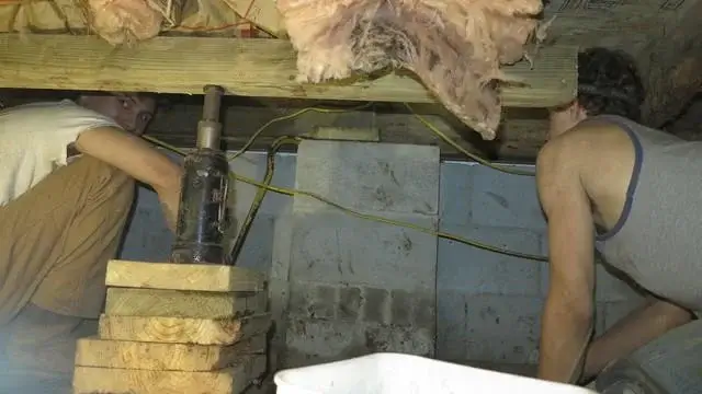 When replacing wood joists underneath a home it's important to prop up the existing joists for added support.