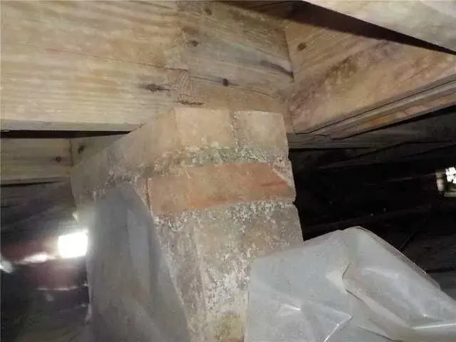 The piers in the crawl space were sinking due to the soil underneath the home.