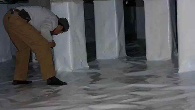 Production Team Leader Israel puts the finishing touch on the CleanSpace system before inviting Donald to take a look.